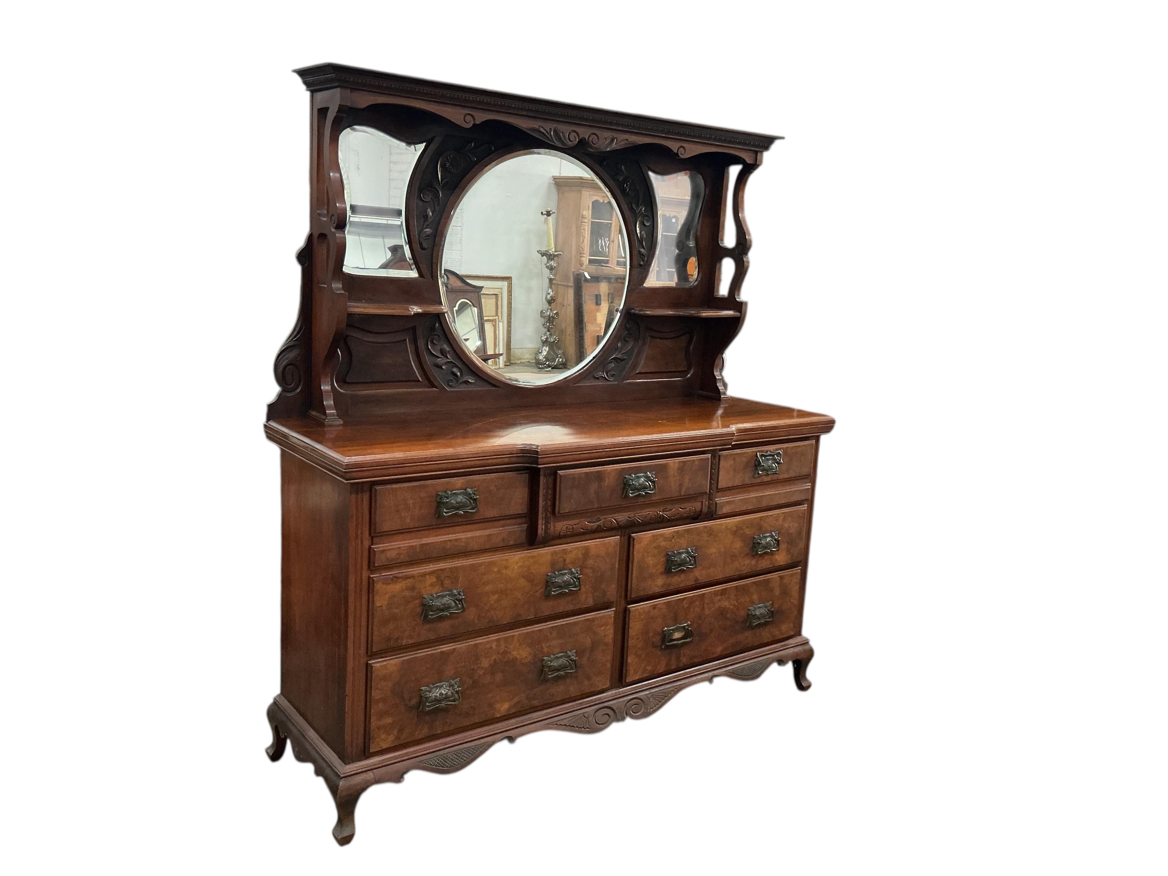 A late Victorian mirrored back walnut sideboard, width 170cm, depth 52cm, height 184cm